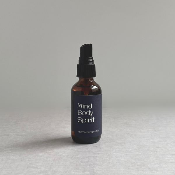 Species by the Thousands Mind Body Spirit Aromatherapy spray with dark blue minimal label.