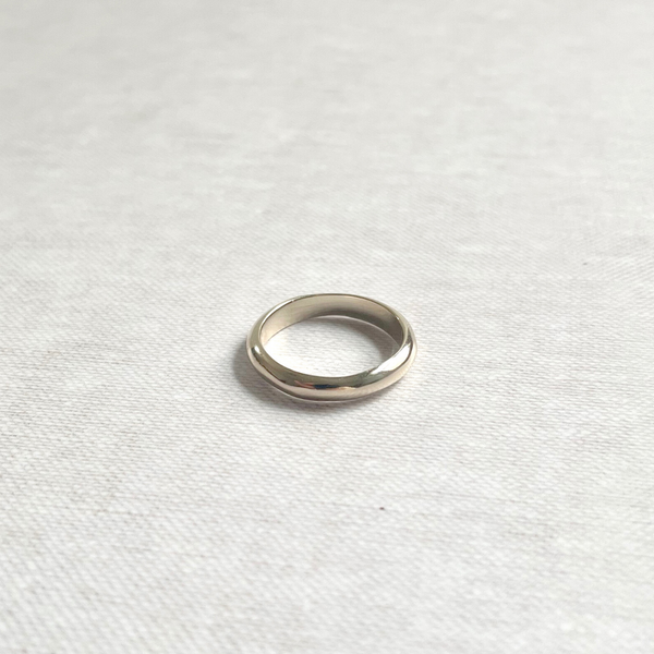 Species by the Thousands curved minimal  band in brass.